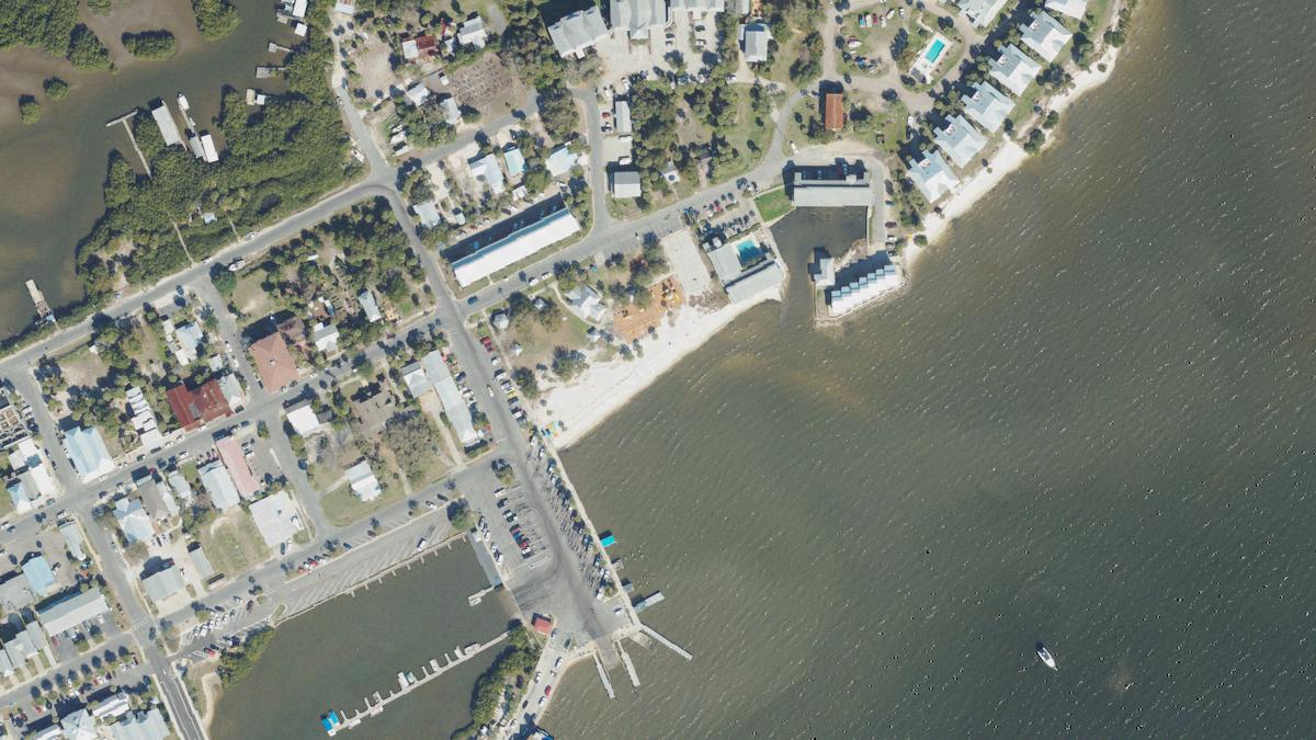 Aerial view of City Beach in Cedar Key, Florida, shoreline and surroundings, USDA NAIP imagery from May 2023