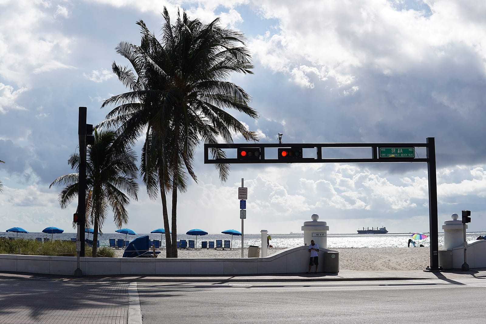 Fort Lauderdale Beach: beach access point with palm trees, umbrellas, traffic signal, ocean view