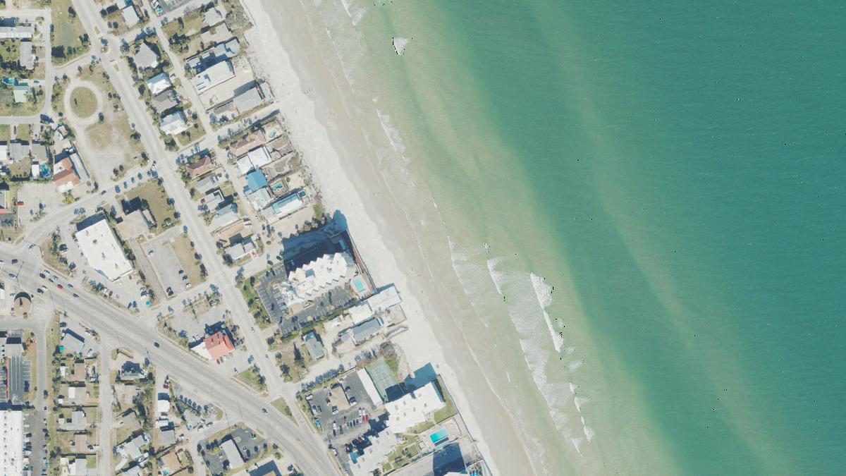 Aerial view of New Smyrna Beach in New Smyrna Beach, Florida, shoreline and surroundings, USDA NAIP imagery from May 2023