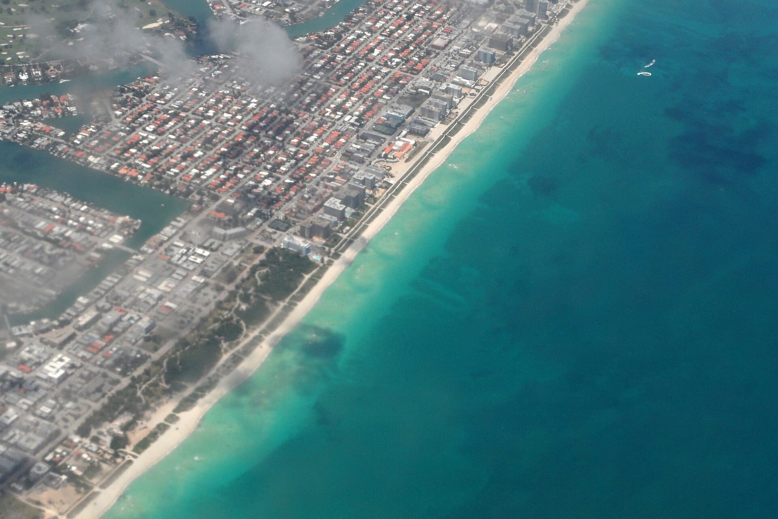 Ocean Terrace Public Beach: aerial view of beachfront residential area and turquoise ocean water